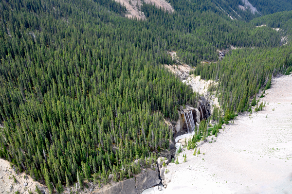 A waterfall and the river, far below